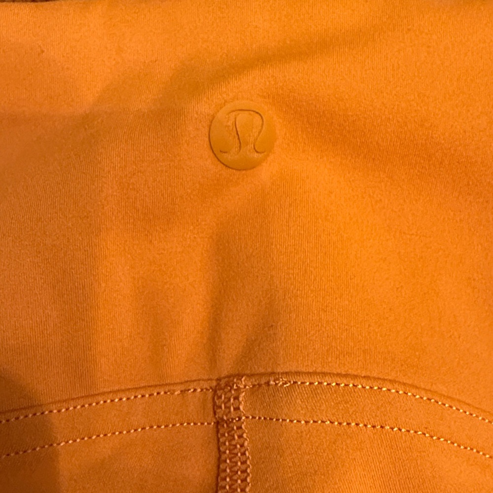 Lululemon orange leggings with front seams size 6